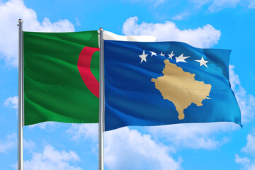 Kosovo and Algeria national flag waving in the windy deep blue sky. Diplomacy and international relations concept.