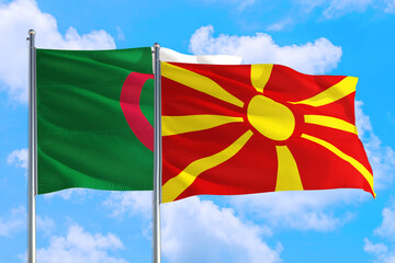 Macedonia and Algeria national flag waving in the windy deep blue sky. Diplomacy and international relations concept.