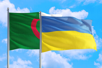 Ukraine and Algeria national flag waving in the windy deep blue sky. Diplomacy and international relations concept.