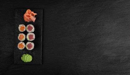 Obraz na płótnie Canvas Salmon Hosomaki Sushi or Thin Maki Sushi Rolls Isolated