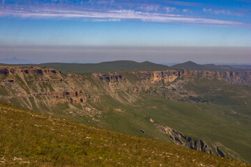 A beautiful gorge in the Caucasus Mountains. Blue sky and huge rocks. Bermamyt plateau