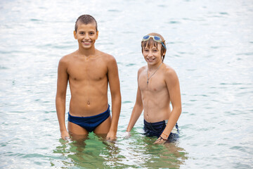 Cheerful boys on the beach