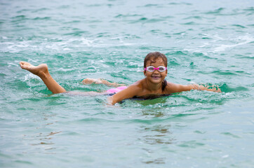 Cheerful girl in the sea