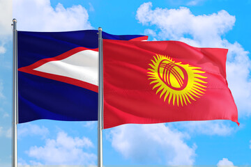 Kyrgyzstan and American Samoa national flag waving in the windy deep blue sky. Diplomacy and international relations concept.