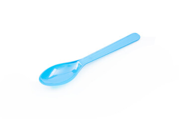 Blue plastic spoon isolated on white background.