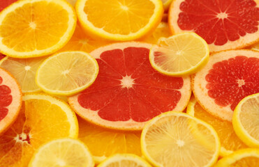 Fototapeta na wymiar Sliced fruits. Lemon, grapefruit, orange
