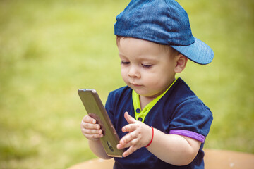 baby with mobile in park