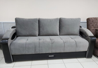new empty grey sofa for sale in the store