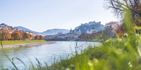European city trip: Salzburg old city and river salzach in autumn, colorful sunshine, Austria