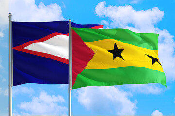 Sao Tome And Principe and American Samoa national flag waving in the windy deep blue sky. Diplomacy...
