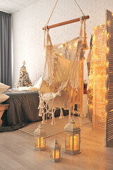 A new year interior in boho style, wicker swing hammock