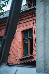 Fototapeta na wymiar window in the old brick wall