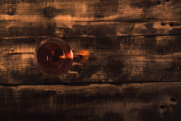 Glass of red wine on a wooden background