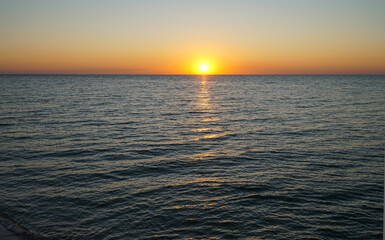 Rising sun over the sea. Early morning.