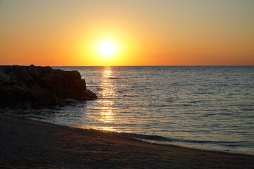 Seashore at dawn. Calm morning.                       