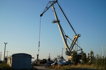 Fototapeta na wymiar Working crane in the port