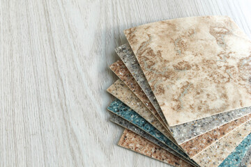 Collection of industrial linoleum samples on a white background.