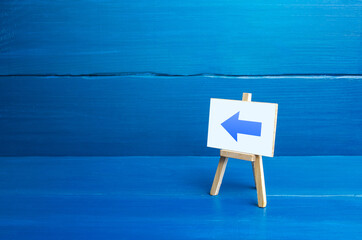 Easel with a left arrow. Sign of direction pointer. Hint, help in navigation. Minimalism....