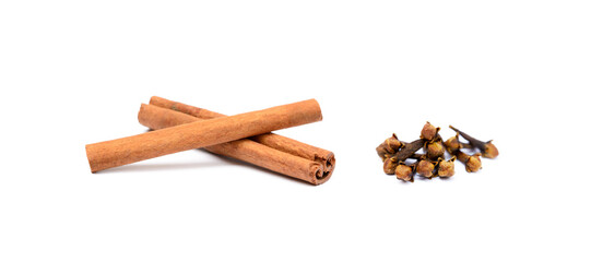 Fragrant cinnamon and cloves isolated on white background