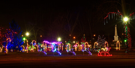 Small-town Christmas display lit up at night