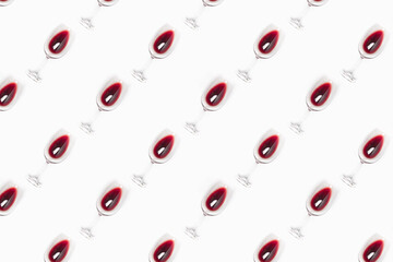 Seamless pattern made of wine glasses filled with red wine