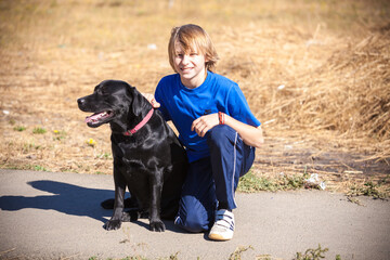Best friends - Little boyl with dog at the nature