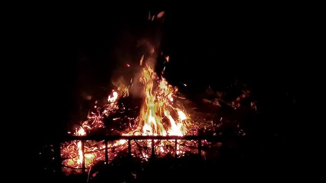 high flames burn with their lapilli flying high