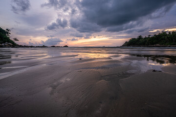 Sunset at Layan beach, lagoon in Phuket, Thailand  during  Low tide