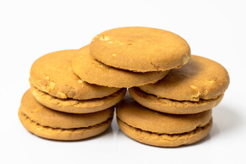 A pile of delicious wheat biscuits on white background