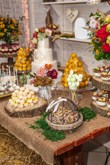 Dessert table with cake and candy on a wedding day