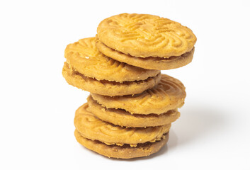 A stack of delicious rounded creamy biscuits close up look isolated on white background