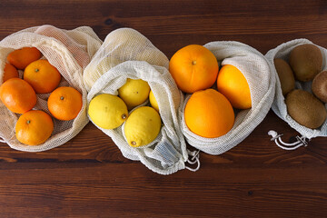 tangerines, oranges, lemons and kiwis in a bag