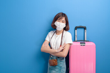 portrait of young traveler woman with face mask , New normal travel concept.