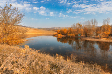 Fototapeta na wymiar Lake in a village in one of the regions of Azerbaijan in autumn