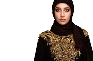 Muslim woman in hijab. Portrait of a young arab girl in traditional dress. White background. 