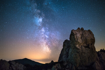 Milky way core over a moutain top with a cliff in Slovakia