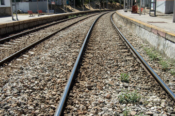 Fototapeta na wymiar background with diagonal train tracks close up view