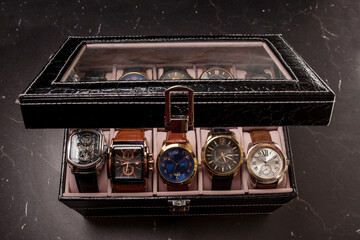 storage box with collection of men wrist watches