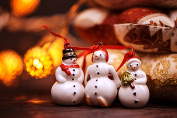 Small toy snowmans on christmas decorations table