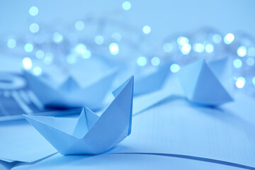 paper boats with small lights
