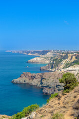 Fototapeta na wymiar Beautiful sea coast with turquoise water and rocks in Fiolent Cape, Crimea. Summer seascape, famous travel destination