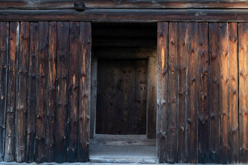 Fototapeta na wymiar Old plank wall and wooden doors