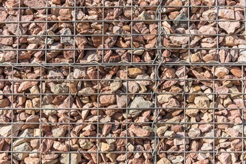 Retaining wall gabion baskets, Gabion wall caged stones textured background. Gabion wall caged stones.