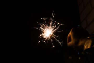 Bright sparkler light in the dark closeup