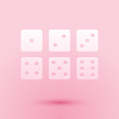 Paper cut Set of six dices icon isolated on pink background. Paper art style. Vector.