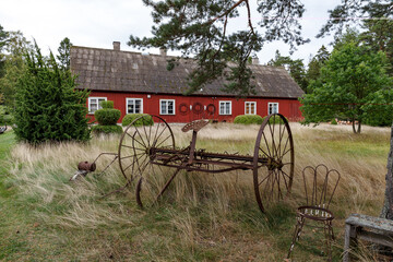 Fototapeta na wymiar Classical Scandivavian red wooden house on Aegna island, Estonia