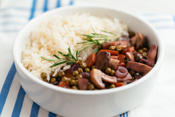 Home made mushroom Bourgogne with peas and carrots on rice