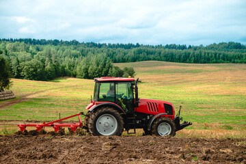 tractor plows the land