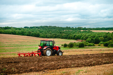 tractor plows the land