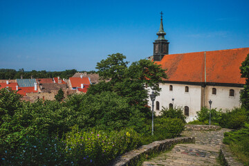 Obraz premium Church with tower in the town of Petrovaradin under blue sky, Novi Sad, Serbia